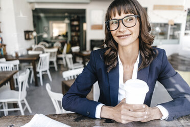 Woman in cafe, drinking coffee - KNSF01908