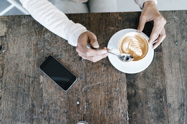 Woman in cafe, drinking coffee - KNSF01920