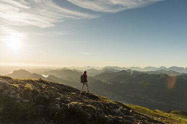 Hiker walking alone in the mountains - UUF11018