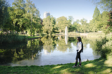 Businesswoman relaxing in the park - KNSF02023