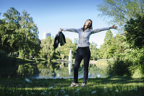 Businesswoman relaxing in the park - KNSF02026