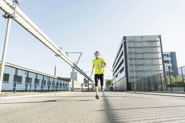 Young athlete jogging in the city - UUF11110