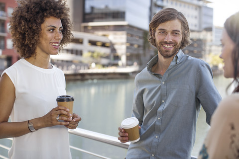 Urban business people taking a break, talking togehter stock photo