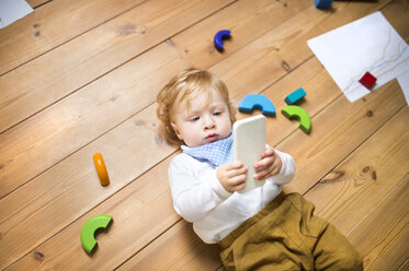 Lttle boy at home playing with smartphone - HAPF01968