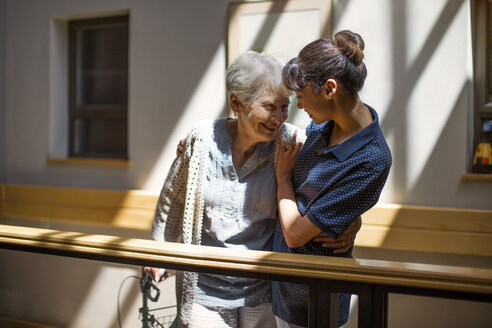 Nurse embracing senior woman in retirement home - ZEF14212