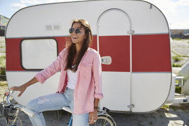 Young woman standing in front of food truck - SUF00242