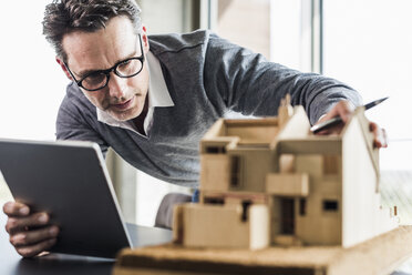 Architect working on architectural model - UUF11252