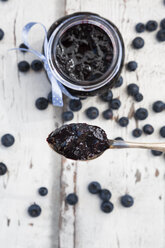 Spoon and glass of blueberry jam and blueberries - LVF06250