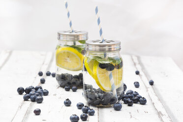 Two glasses of infused water with lemon slices, blueberries and mint - LVF06254