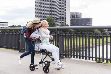 Grandmother and granddaughter having fun together - UUF11361