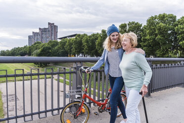 Happy grandmother and granddaughter spending time together - UUF11363