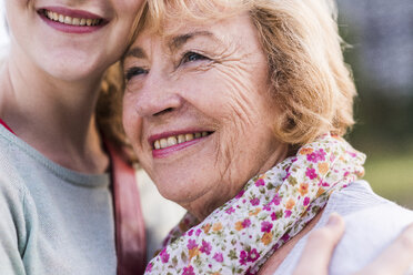 Portrait of happy senior woman with her granddaughter - UUF11385