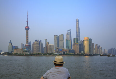 China, Shanghai, back view of man looking at Pundong - EAF00016