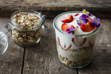 Glass of granola with natural yogurt, strawberries and Horned Violets - EVGF03262