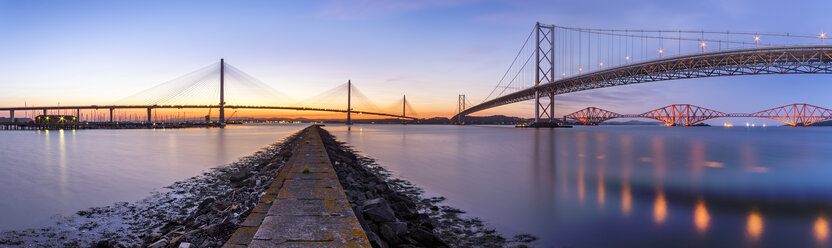 UK, Scotland, Fife, Edinburgh, Firth of Forth estuary, Panorama view from South Queensferry of Forth Bridge, Forth Road Bridge and Queensferry Crossing Bridge at sunset - SMAF00811