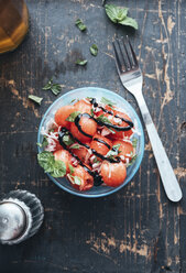 Watermelon salad with eschalot, mint, olive oil and balsamico in bowl - IPF00406