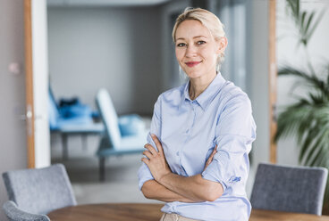 Portrait of confident businesswoman in office - UUF11404