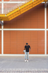 Young man playing with soccer ball - MGIF00090