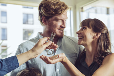 Couple receiving key to their new home - MFF03809