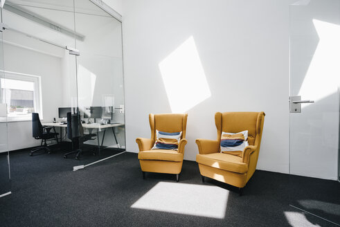 Armchairs in empty modern office - KNSF02321