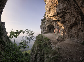 Italy, Veneto, Strada delle 52 Gallerie, hiker on the move - LAF01853