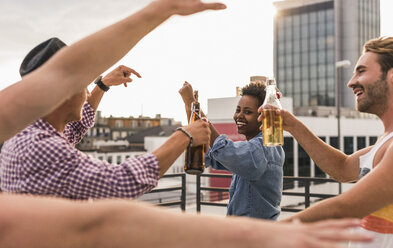 Friends having a rooftop party - UUF11475