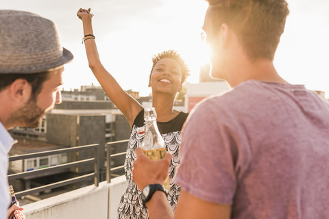 Friends having a rooftop party stock photo