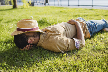 Young man sleeping on a meadow - MRAF00214