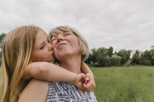 Granddaughter kissing her grandmother - NMSF00152