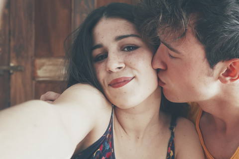 Portrait of young couple taking selfie stock photo