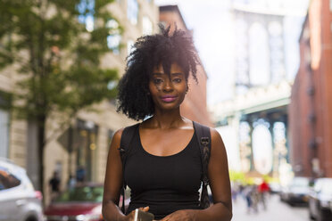 USA, New York City, Brooklyn, portrait of smiling woman - GIOF03078