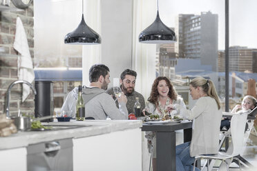 Family and friends having dinner together - ZEF14433