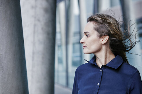 Portrait of businesswoman with blowing hair - RORF00976