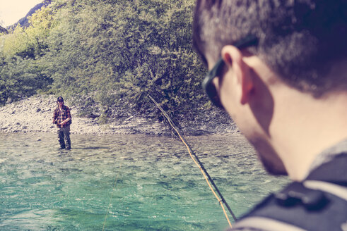 Slovenia, two men fly fishing in Soca river - BMAF00312