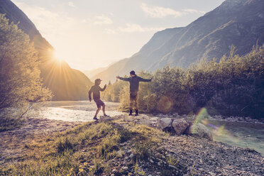 Slovenia, Bovec, two men at Soca river - BMAF00328