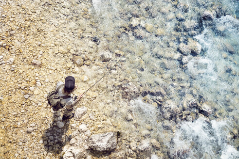 Slovenia, top view of man fly fishing in Soca river - BMAF00341