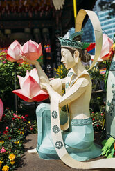 South Korea, Seoul, Woman with lotus lantern at Jogyesa Temple to celebrate Buddha's Birthday - GEMF01755