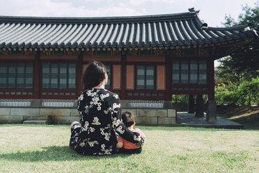 South Korea, Seoul, Mother and baby girl visiting Gyeongbokgung Palace - GEMF01762