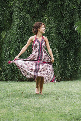 Happy woman in a park wearing summer dress - ALBF00183