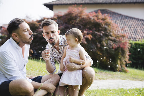 Gay couple playing with their child in the garden - MRAF00228
