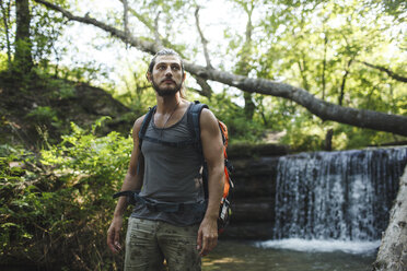 Young man on a hiking trip at a waterfall - VPIF00027