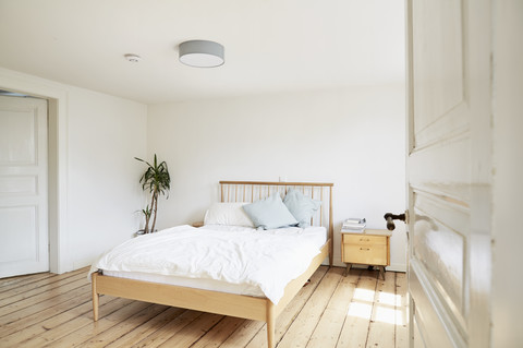 Bright modern bedroom in an old country house stock photo