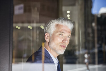 Portrait of a mature man, looking out of window - WESTF23523