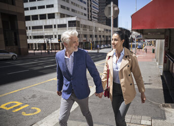 Mature couple walking in the city - WESTF23527