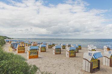 Germany, Timmendorf Beach with hooded beach chairs - KEBF00607