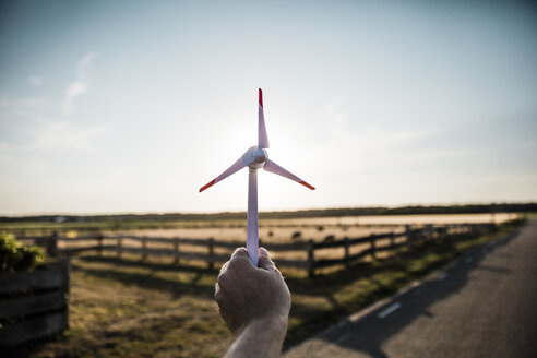 Hand holding miniature wind turbine - MOEF00089