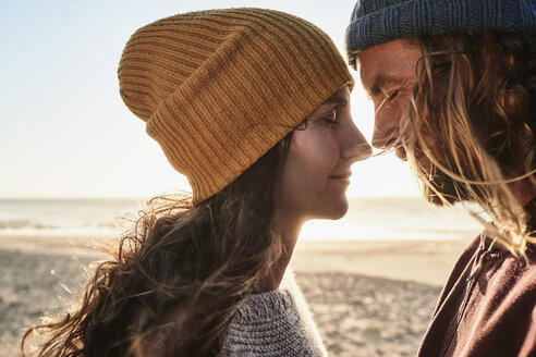 Portugal, Algarve, affectionate couple on the beach at sunset - JRF00335