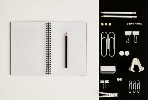 White office utensils on black background and notepad and pencil on whilte background - MELF00186