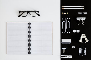 White office utensils on black background and notepad and glasses on whilte background - MELF00187