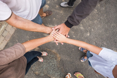 Family stacking hands - SIPF01688